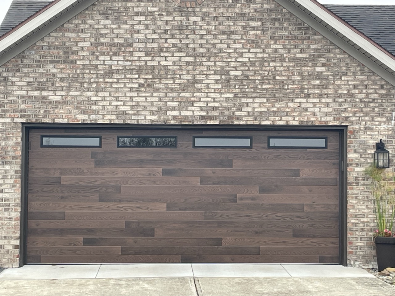 Dark Plank Door — Brick Home